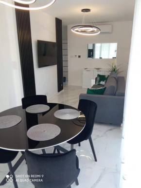 Apartament z bocznym widokiem na morze w kompleksie Hevenia, Rewal